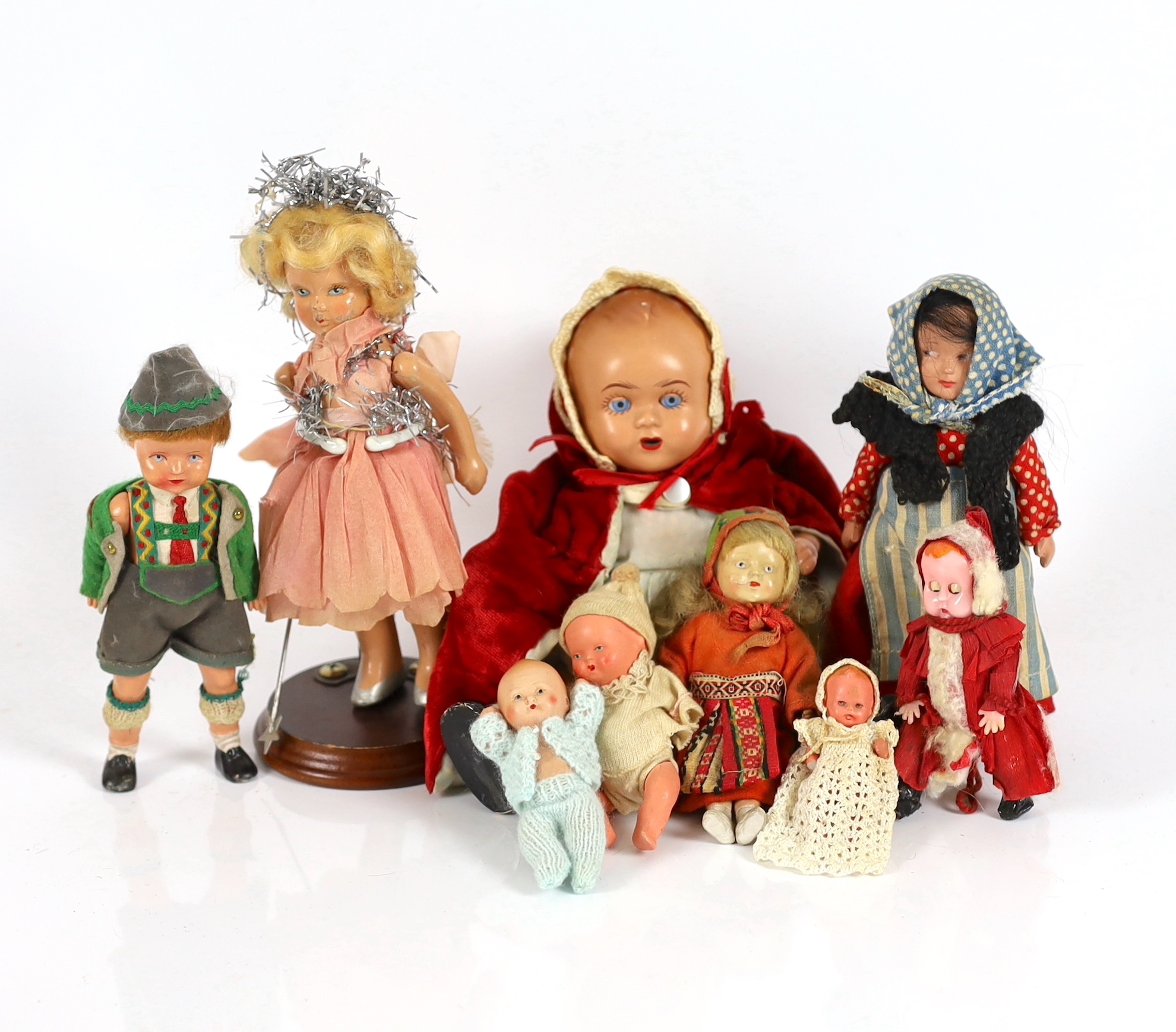 Nine assorted small dolls, mainly composition or plastic